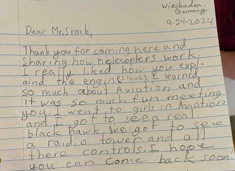 Caroline, a third grade student, reflects on her learning objectives and wrote a thank you card to one of the speakers. (Photo credit Maria Schultz)